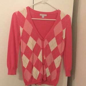 Pink and white argyle cardigan. Button up.